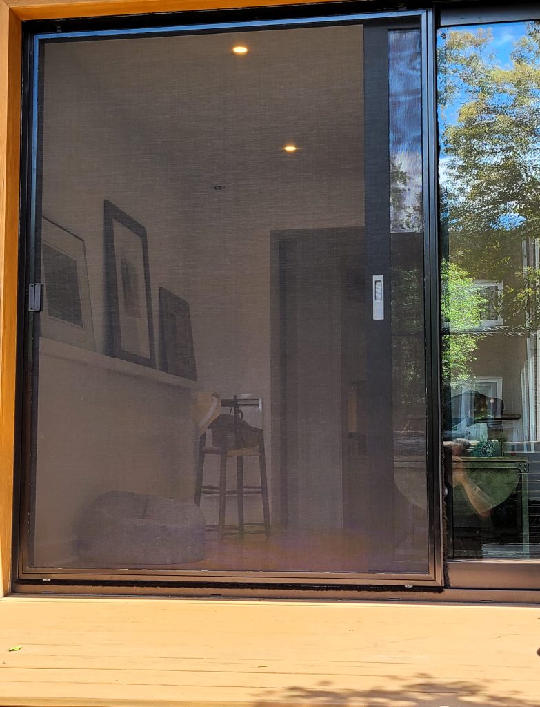 Window screen mesh being repaired